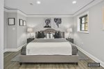 Fourth bedroom delivers a king-sized, memory foam mattress -basement floor-